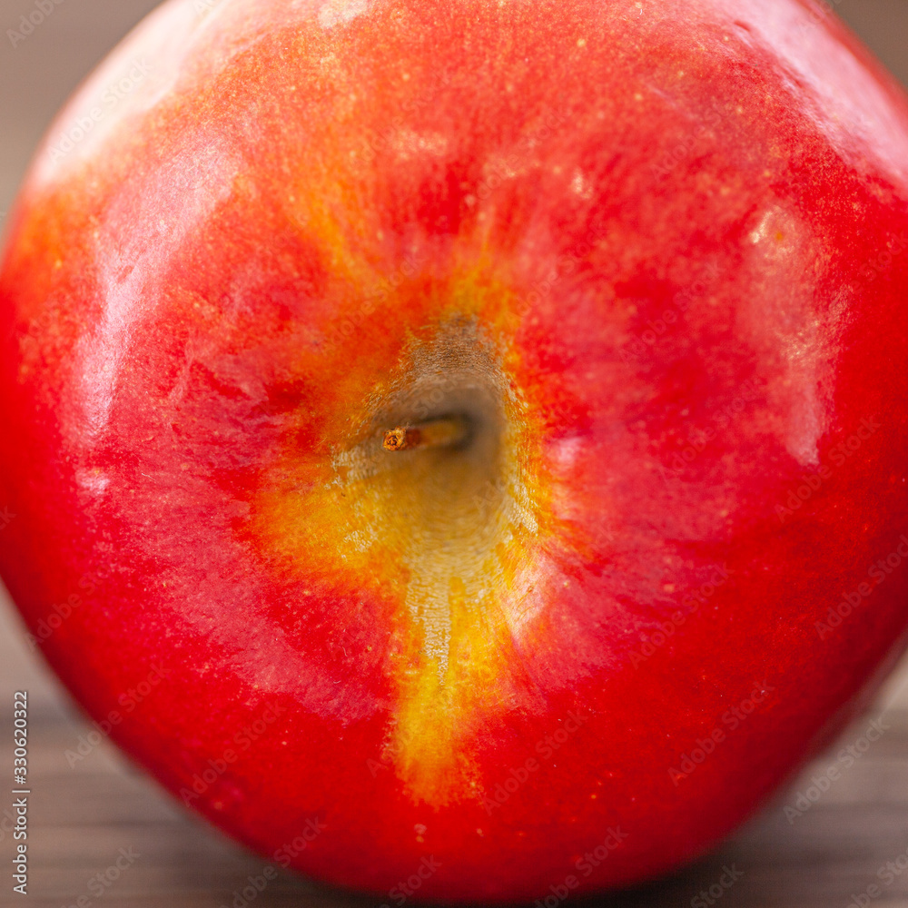 Wall mural red apple on wood table