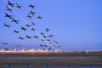 Multi Exposure or Warsaw Chopin Airport runway, planes takeoff.