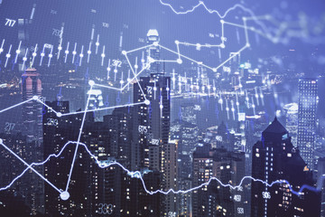 Double exposure of forex chart drawings over cityscape background. Concept of success.