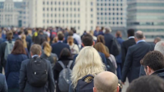Crowd of pedestrian commuters in London on cool morning in slow motion. Clip 35b