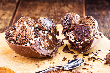 easter egg cut in half and creamy chocolate filling. Creative easter dessert concept