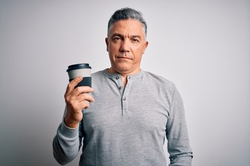 Middle age handsome grey-haired man drinking cup of coffee over isolated white background with a confident expression on smart face thinking serious