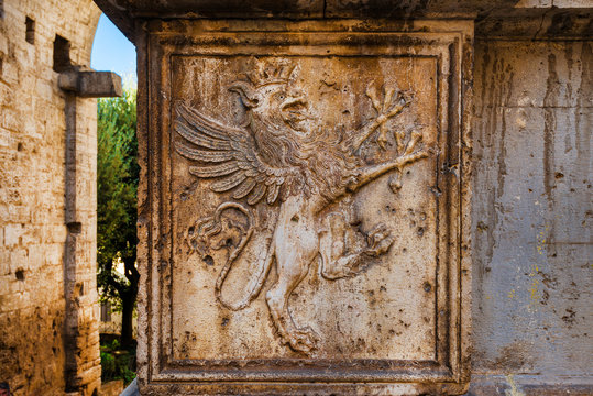 Griffon symbol of  Perugia in Umbria on medieval Gate of St Luke in the city historic center