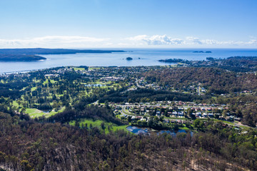 Fototapeta na wymiar Panoramic aerial drone view of Batemans Bay on the New South Wales South Coast, Australia, looking out to Tasman Sea on a sunny day 
