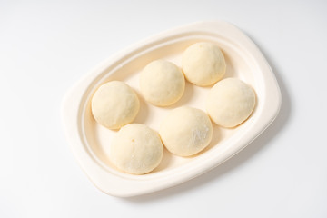 Fototapeta na wymiar A dish of Chinese bread on a white background