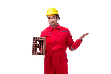 Young male mason with brick isolated on white