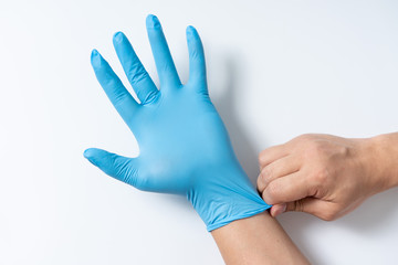 Hands are wearing nitrile gloves