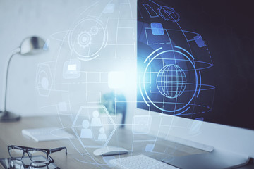 Computer on desktop with social network hologram. Multi exposure. Concept of international people connections.