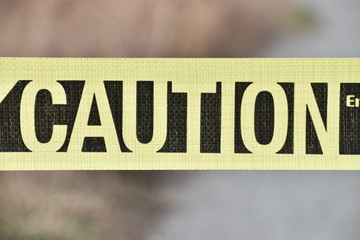 bold bright yellow caution tape 