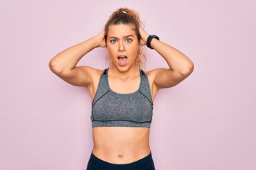 Fototapeta na wymiar Young beautiful blonde sportswoman with blue eyes doing exercise wearing sportswear Crazy and scared with hands on head, afraid and surprised of shock with open mouth