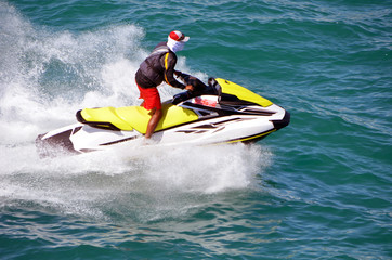 Jet skier riding waves on the Florida Intra-Coastal Waterway off Miami Beach.