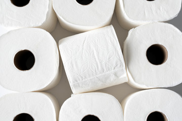 Rolls of white toilet paper background for personal hygiene