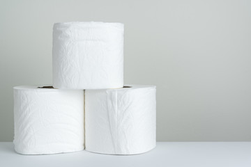 Rolls of white toilet paper background for personal hygiene
