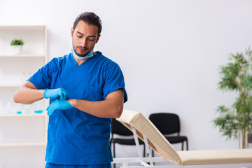 Young male doctor working in the clinic