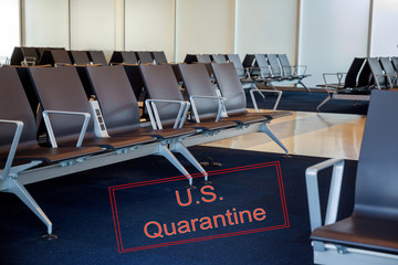 Canceled travel US quarantine with coronavirus COVID-19 empty airport departure lounge terminal waiting area with chairs