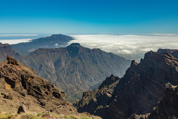 Landscape in the volcanic crater Caldera de Taburiente Natoional Park seen from mountain peak of Roque de los Muchachos Viewpoint, island La Palma, Canary Islands, Spain
