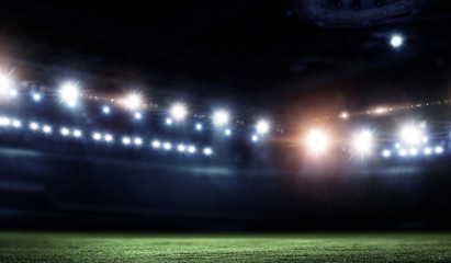 Fototapeta na wymiar Night football arena in lights close up