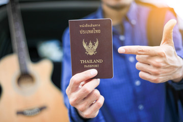 plan travel Vacation,thai passport and car,guitar background