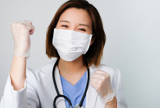 Asian Doctor Wear The Medical Mask To Protect And Fight Infection From Germ, Bacteria, Covid19, Corona , Sars , Influenza Virus On White Background.