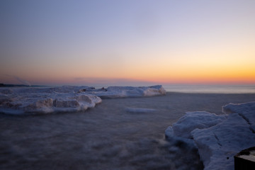 Icy water floating at sunset, South Haven Lake Michigan long exposure