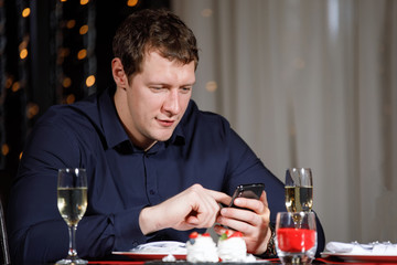 Man looks in the phone.