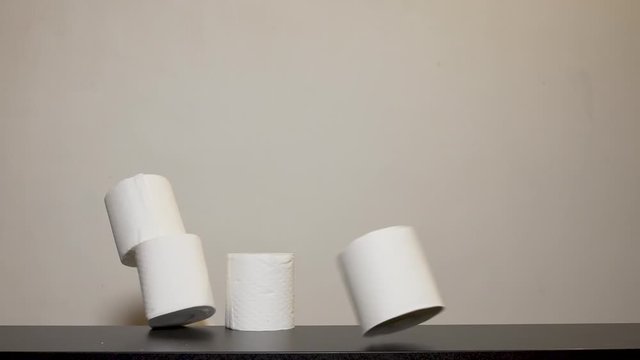 Coronavirus - Toilet Roll stack knocked down - slow motion
