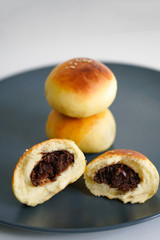 Chinese dessert: a plate of small bread filled with bean paste. Chinese breakfast on a plate of small bread filled with bean paste.