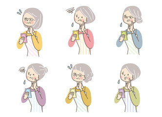 スマホ　困った　シニア女性　エプロン