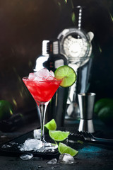 Summer cold drink with watermelon, mint and lime on black background. Copy space