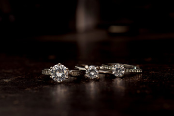 Wedding ring Is a diamond ring on the wooden floor