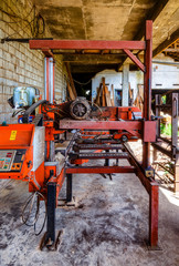 Fototapeta na wymiar old small sawmill with worn-out wood-cutting equipment, Asia, Sri Lanka, tropics.