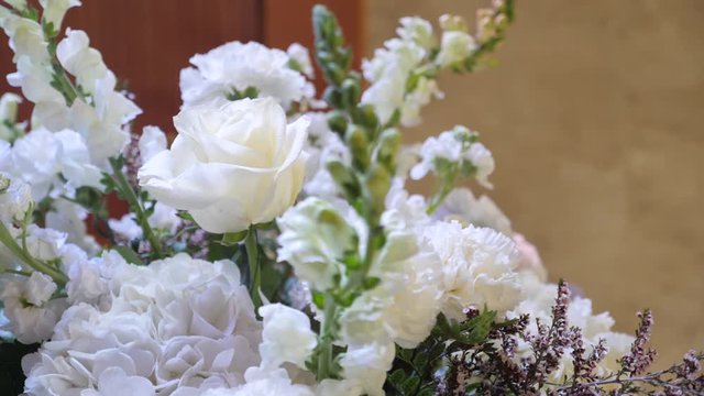 Wedding details. Beautiful bouquet with fresh white rose. Close up parallax shot