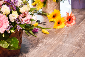 Floral bouquets on the table. Floral background. Tools of the florist.