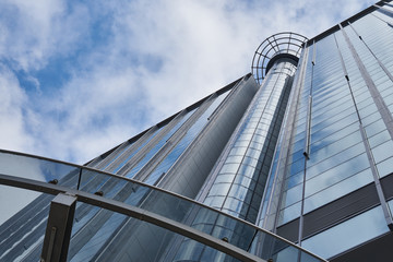 Image of the glass facade of a modern building.