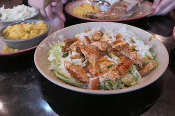 Close up of chicken salad on plate on table 