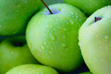 Close up of fresh green apple with eater drops 