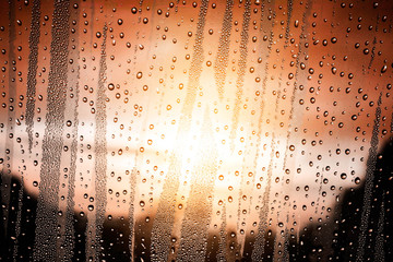 Water drops on glass and sunlight.