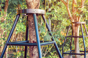 Black steel column supports and controls the branches and trunks of the tree to stand upright and beautiful in the park.