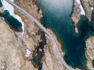 Aerial view of road and snow mountain lake of Aurlandsfjellet