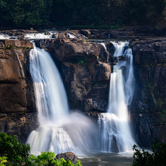 Beautiful long exposure view of Athirappilly water falls, which originates from the upper reaches of the Western Ghats, Chalakkudy, Thissur, India.