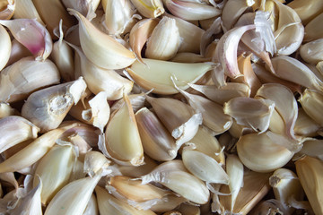 View of broken down garlic pieces. Garlic helps build immunity against cold and flu.