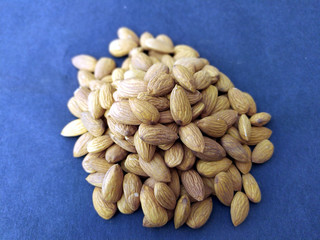some fresh healthy almonds put on black background