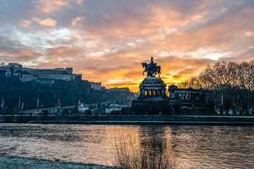 Colorful Sunrise burning sky Koblenz City historic monument German Corner where river rhine and...