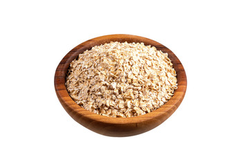 Raw oat-flakes in wooden bowl. Isolated on white background. Uncooked dry rolled oatmeal.