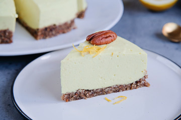Homemade lemon raw vegan cake - healthy dessert made from coconut milk, butter, cashew, if-if