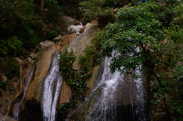 Fototapeta na wymiar Small waterfall under the famous neer garh Waterfall, Rishikesh, Uttarakhand India.