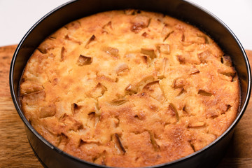 homemade cake in pan on wooden Board. 