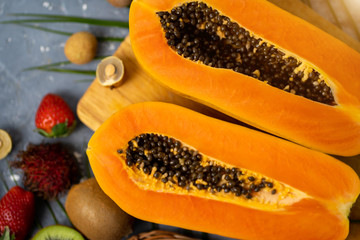 Exotic fruits, papaya on table