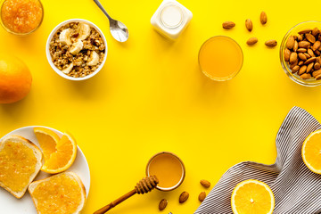 Breakfast with granola mockup on yellow background top-down copy space
