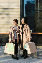 Two young Asian women shopping